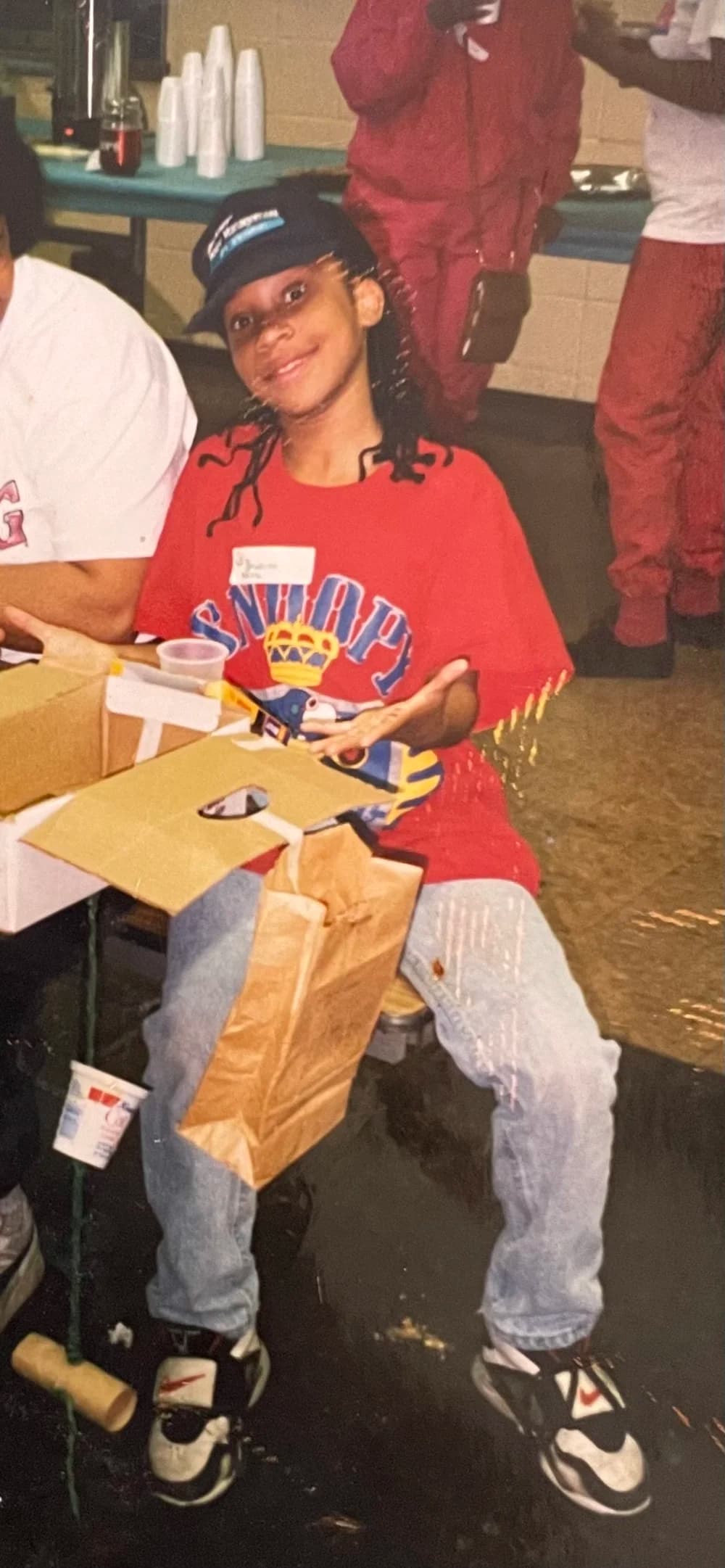 Red tee, cardboard